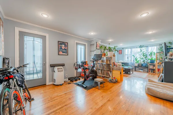 a living room with furniture and wooden floor