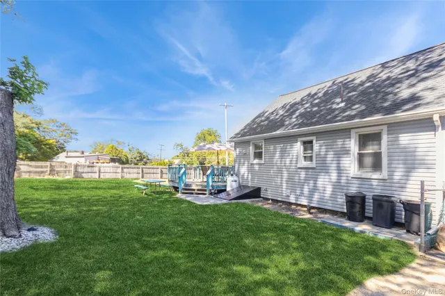 a view of a house with a yard porch and sitting area