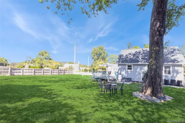 a view of a house with a yard porch and sitting area