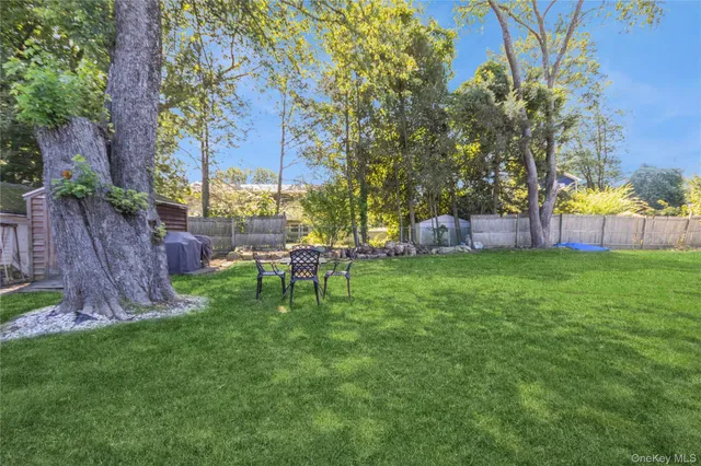 a view of a chairs in a backyard