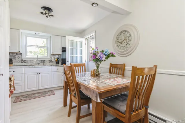 a view of a dining room that has a table and chairs
