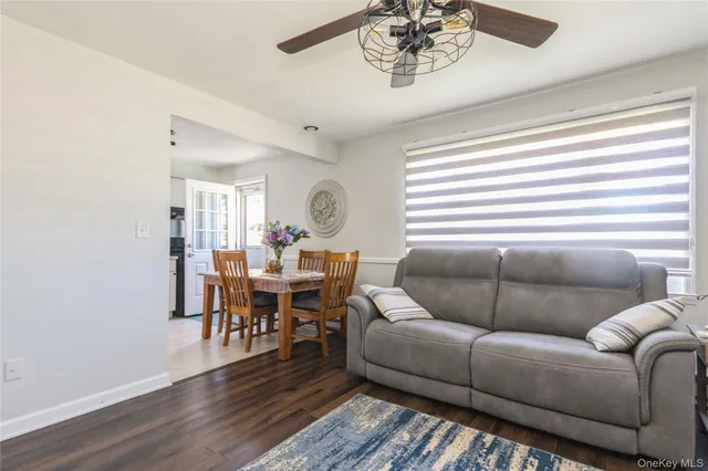 a living room with furniture or couch and a dining table
