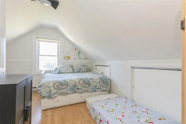 a bedroom with a bed and a window in it