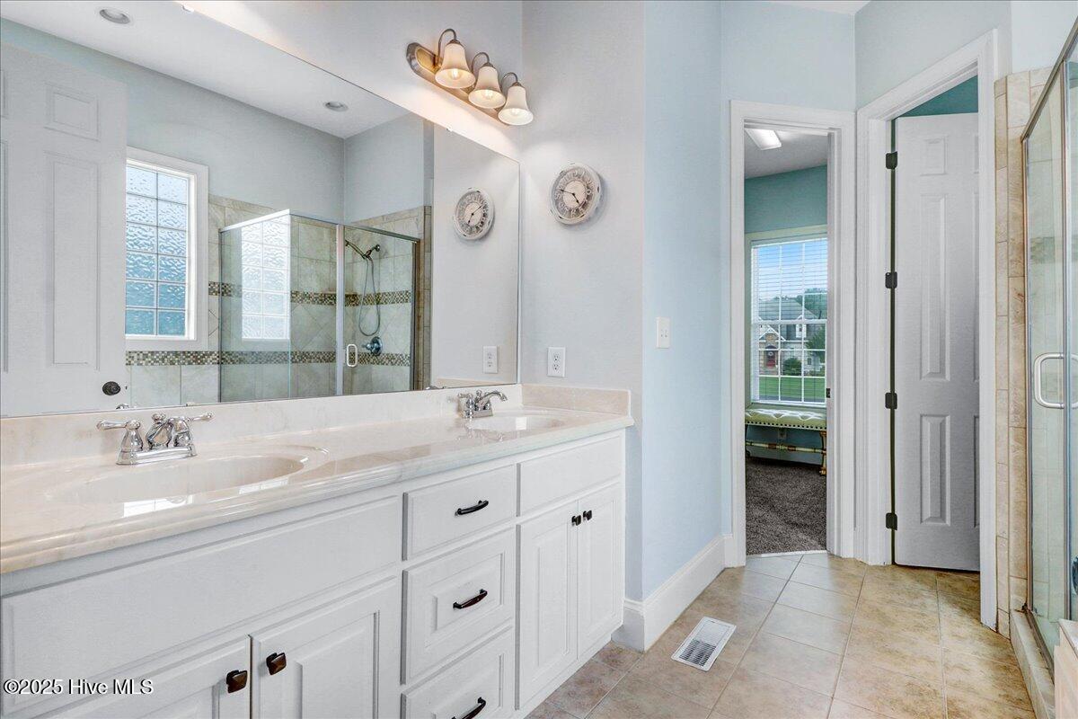 6886 Williams Place Sims, NC 27880 - Photo 17 of 31 Primary Bath, first floor. Tile flooring, spa jetted tub and walk in shower
