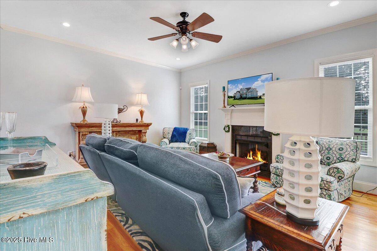 6886 Williams Place Sims, NC 27880 - Photo 8 of 31 Living room with gas log fireplace. Propane tank needed (photo for representation purposes only). Open to kitchen -overlooks the backyard.