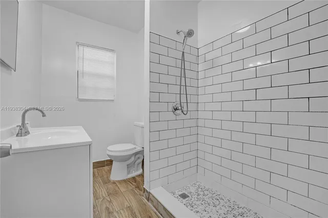 a bathroom with a shower and toilet