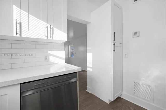 a view of a kitchen with a sink