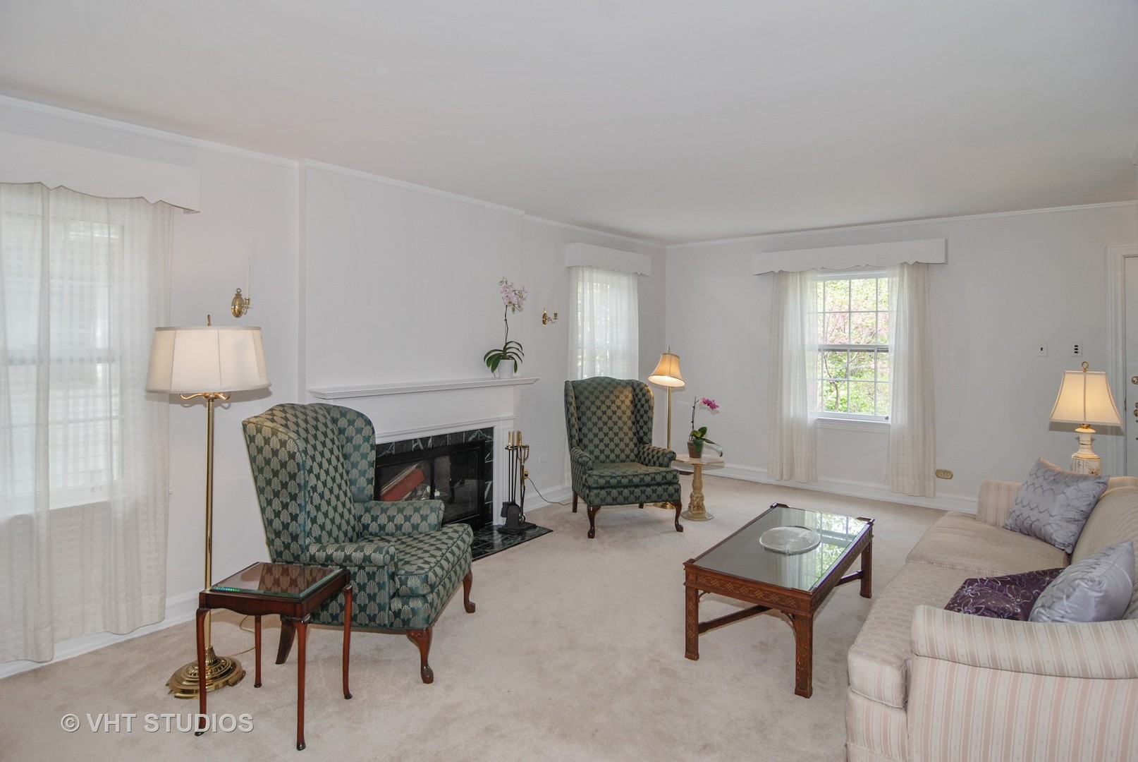 199 Parkview Road Riverside, IL 60546 - Photo 3 of 32 a living room with furniture a fireplace and a window
