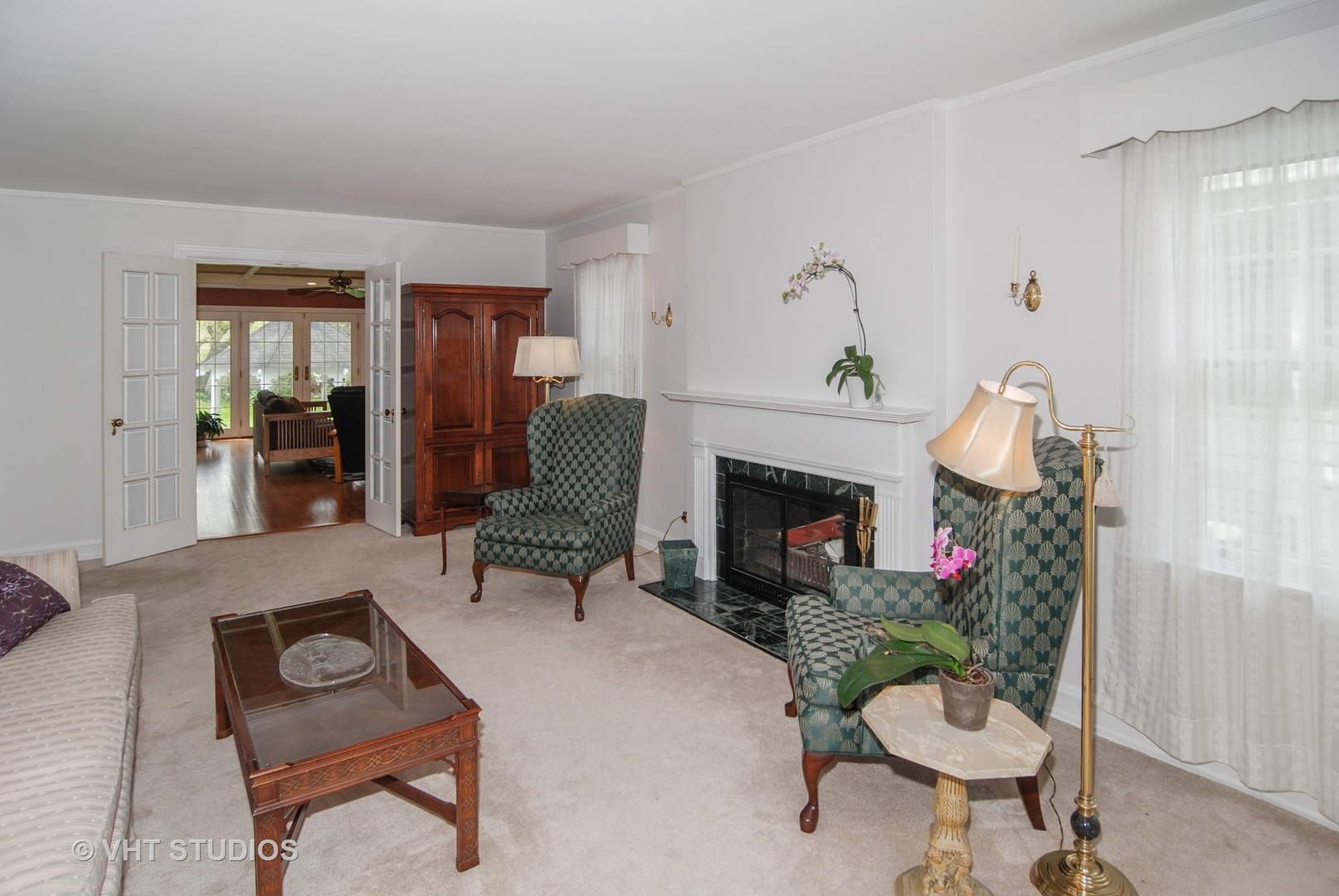 199 Parkview Road Riverside, IL 60546 - Photo 4 of 32 a living room with furniture a fireplace and a potted plant