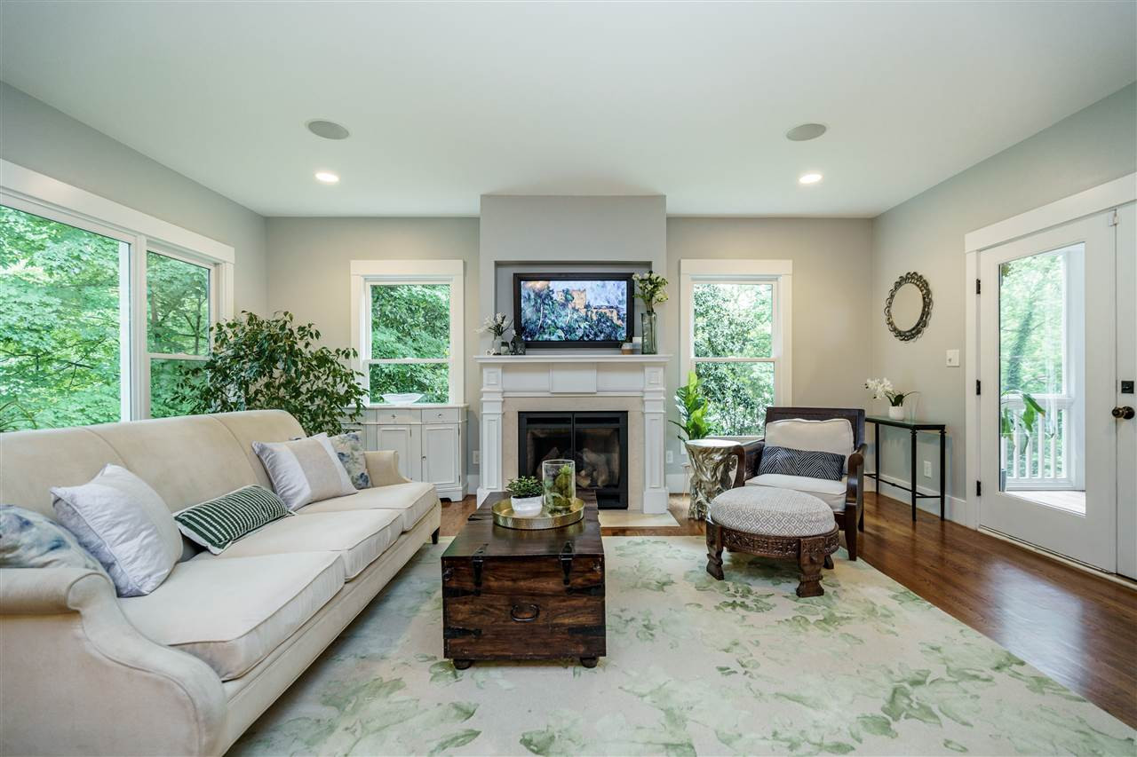 2713 Kilgore Avenue Raleigh, NC 27607 - Photo 9 of 30 The family room opens to a large screen porch with N.C. Cedar floors. There is a gas line run to the deck area for the grill in your life. family room