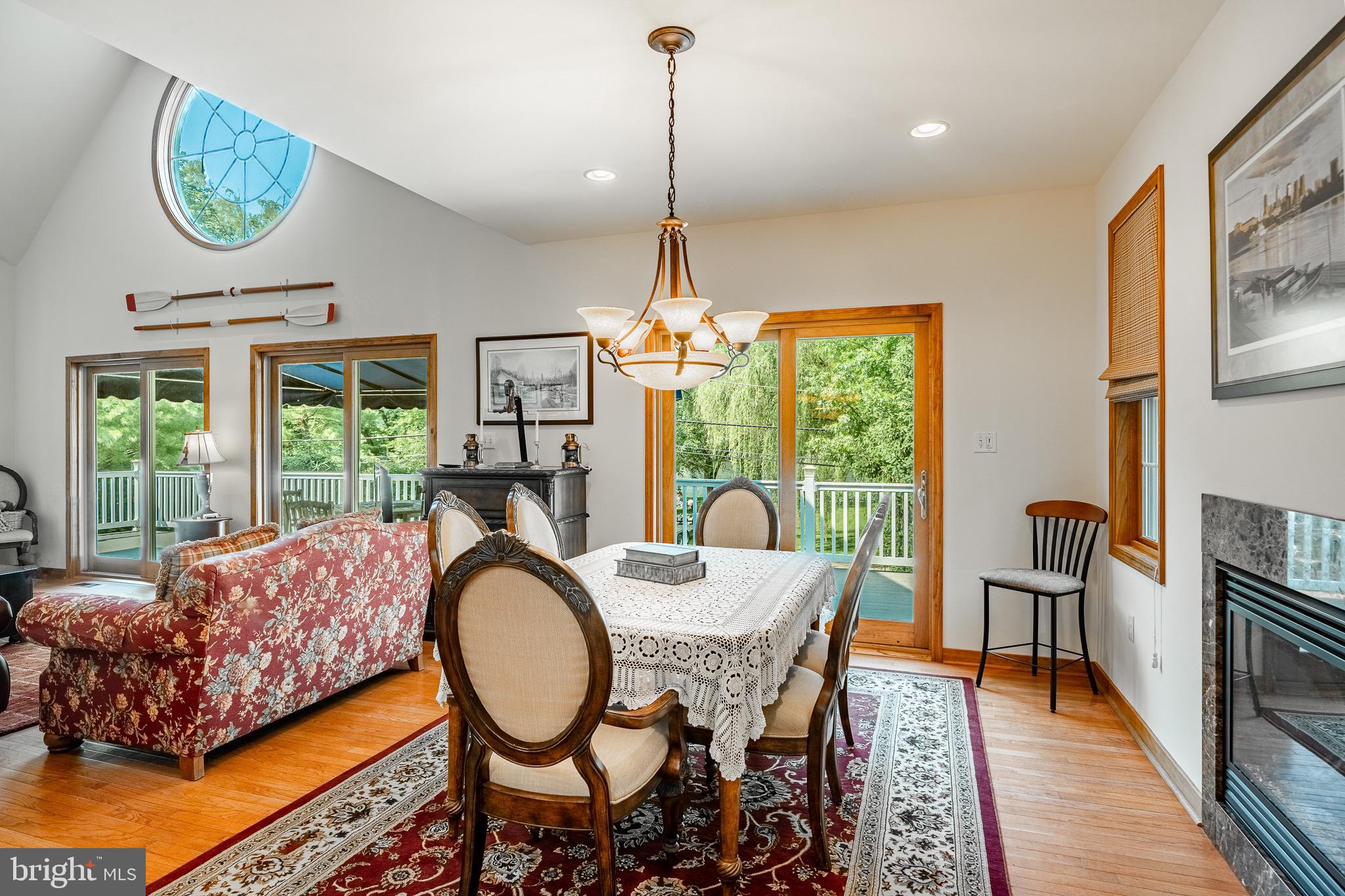 2 River Road Philadelphia, PA 19128 - Photo 14 of 46 a dining room with furniture a chandelier and wooden floor
