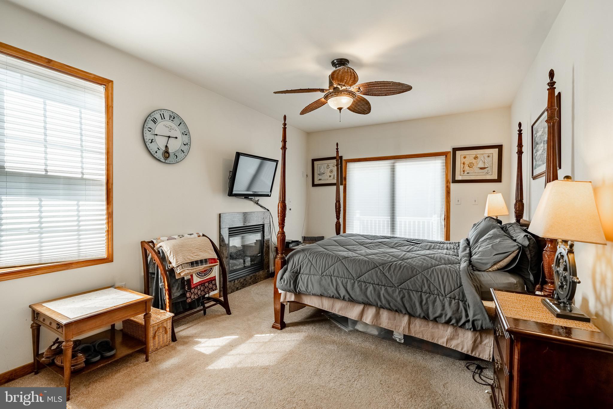 2 River Road Philadelphia, PA 19128 - Photo 20 of 46 a bedroom with a bed and a chandelier