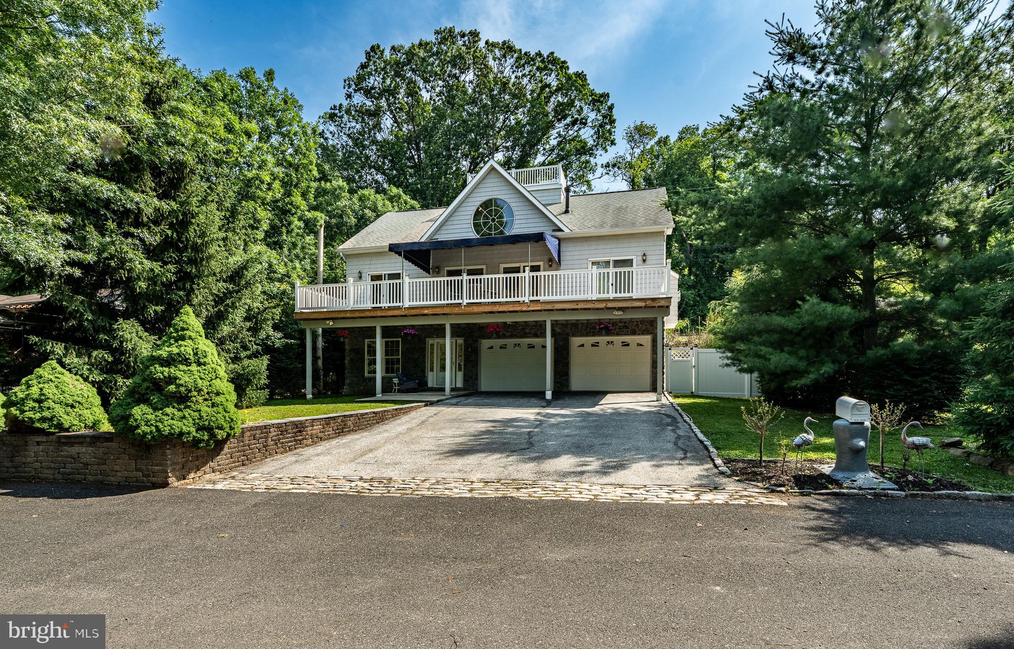 2 River Road Philadelphia, PA 19128 - Photo 2 of 46 a house with trees in the background