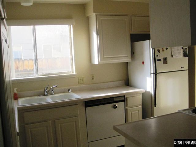 2840 Santa Ana Drive Reno, NV 89502 - Photo 3 of 13 a kitchen with stainless steel appliances a sink a refrigerator and a window