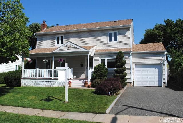 14 Knickerbocker Road South Plainview, NY 11803 - Photo 1 of 1 a front view of a house with a yard