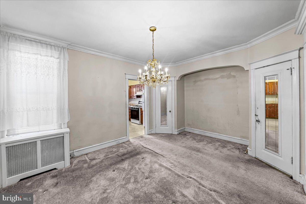 217 Avon Road Upper Darby, PA 19082 - Photo 6 of 16 a view of a chandelier in big room and chandelier