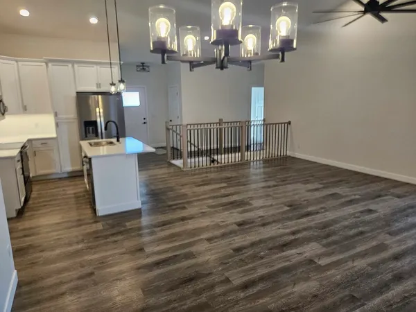 a view of kitchen and dining room with wooden floor