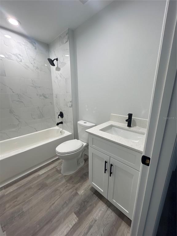 6688 Cherry Road Ocala, FL 34472 - Photo 7 of 9 a bathroom with a sink a toilet and shower
