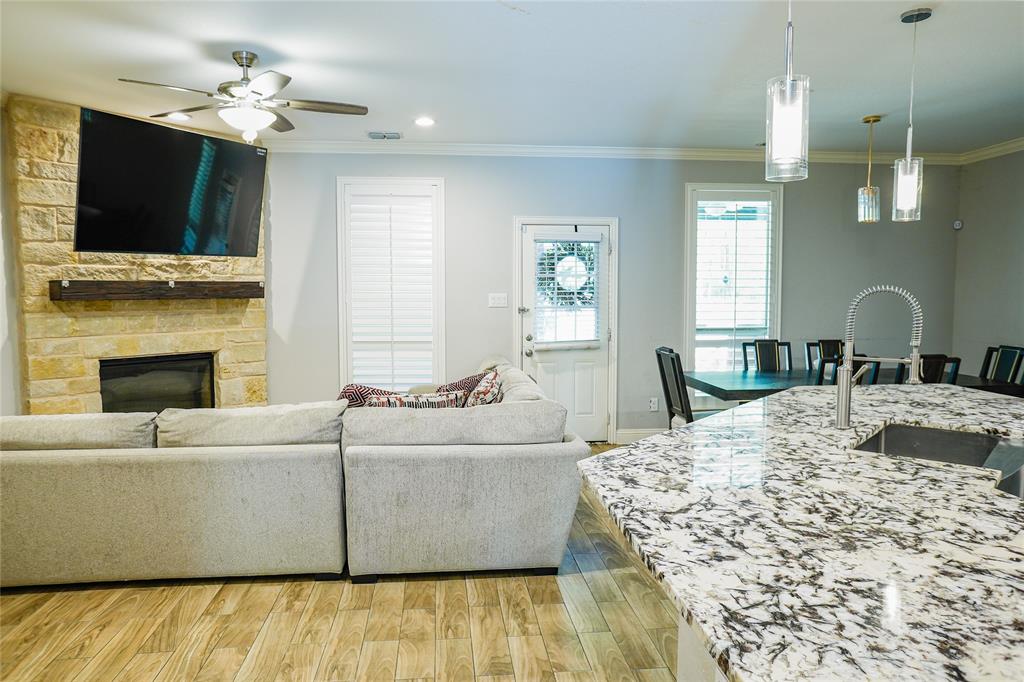1012 Bowers Road Seagoville, TX 75159 - Photo 11 of 26 a living room with furniture fireplace and flat screen tv