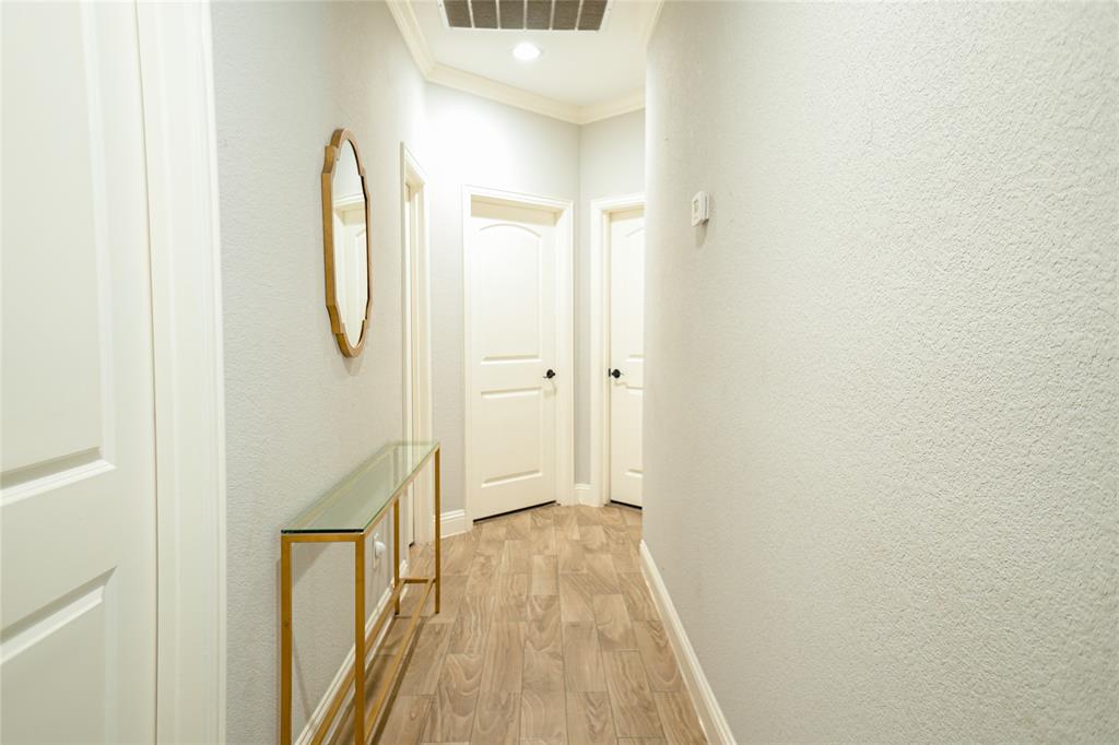 1012 Bowers Road Seagoville, TX 75159 - Photo 19 of 26 a view of a room with wooden floor and white walls