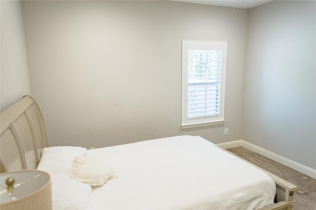 1012 Bowers Road Seagoville, TX 75159 - Photo 20 of 26 a bedroom with a bed and a window