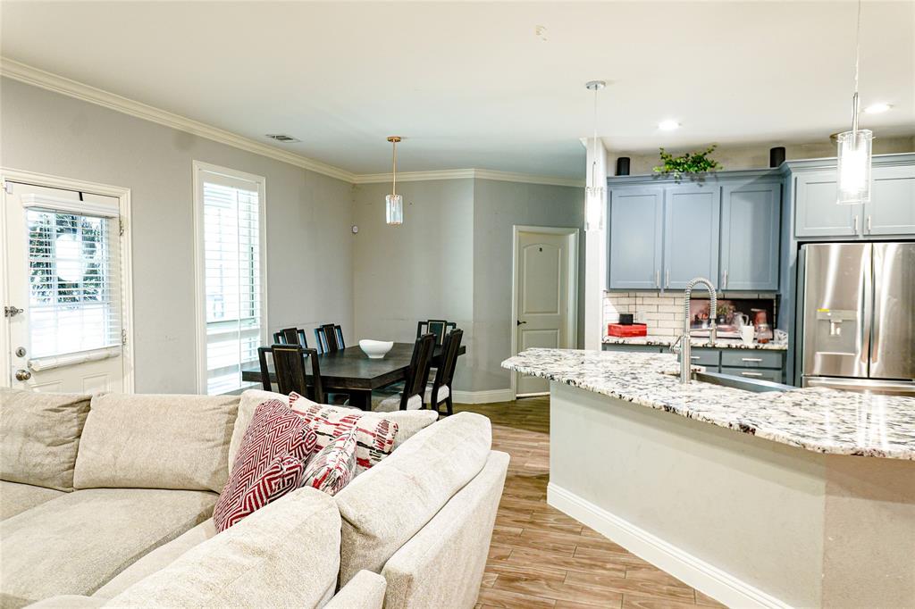 1012 Bowers Road Seagoville, TX 75159 - Photo 21 of 26 a living room with kitchen island furniture and a kitchen view