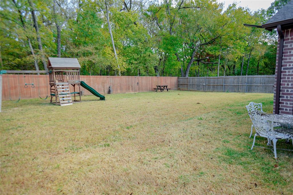 1012 Bowers Road Seagoville, TX 75159 - Photo 26 of 26 a backyard of a house with table and chairs