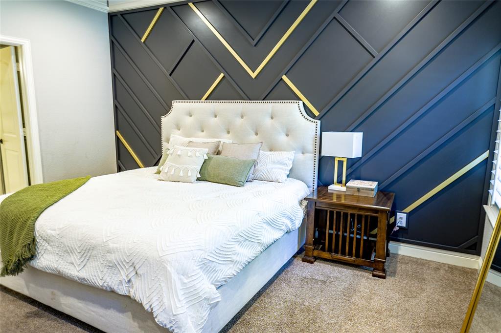 1012 Bowers Road Seagoville, TX 75159 - Photo 3 of 26 a bedroom with a bed and a ceiling fan