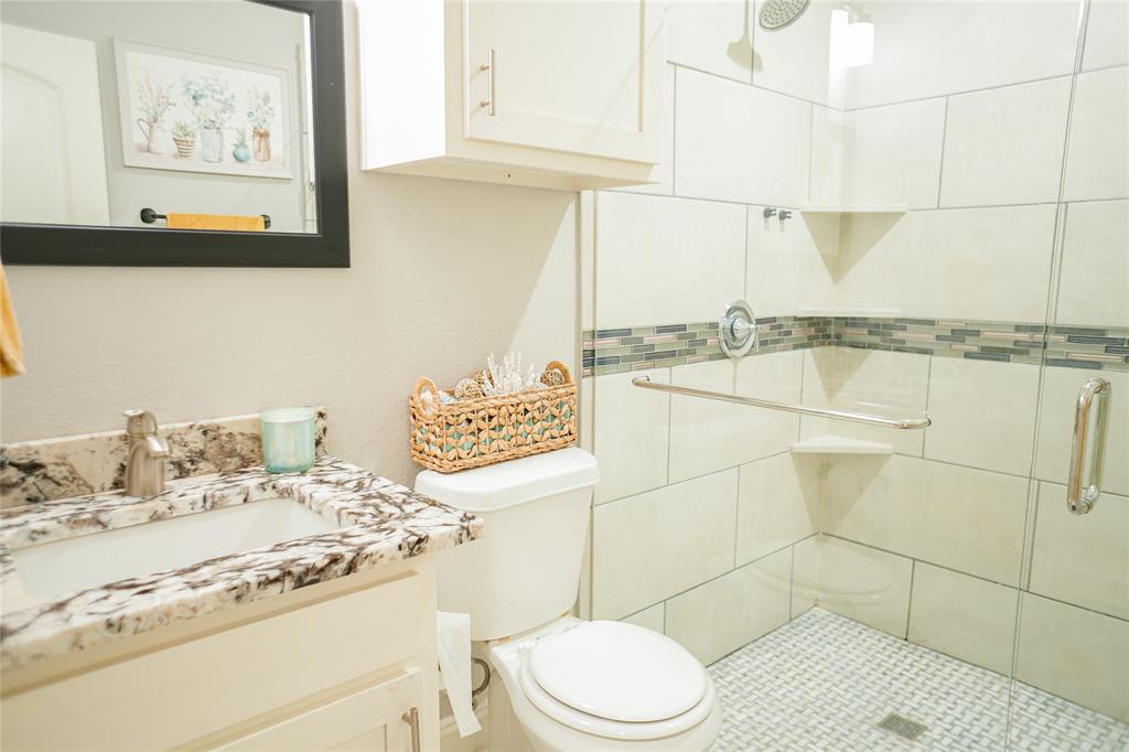 1012 Bowers Road Seagoville, TX 75159 - Photo 4 of 26 a bathroom with a toilet sink and shower