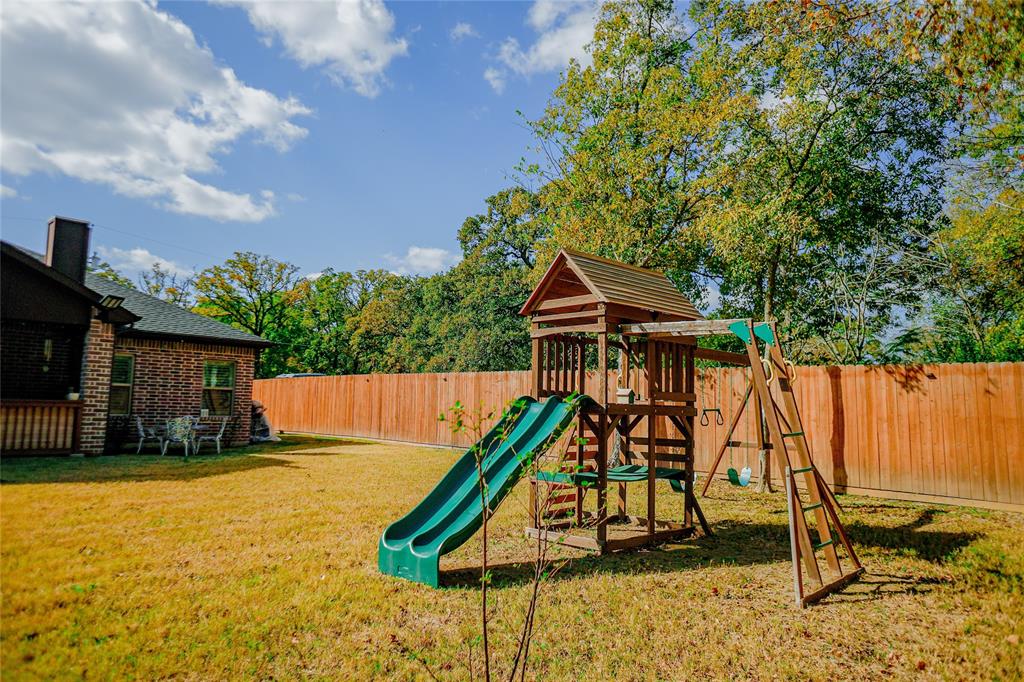 1012 Bowers Road Seagoville, TX 75159 - Photo 7 of 26 a wooden bench sitting in front of a house
