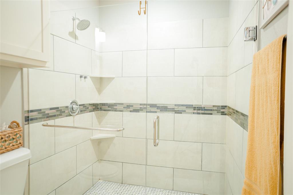 1012 Bowers Road Seagoville, TX 75159 - Photo 9 of 26 a bathroom with a shower and a window