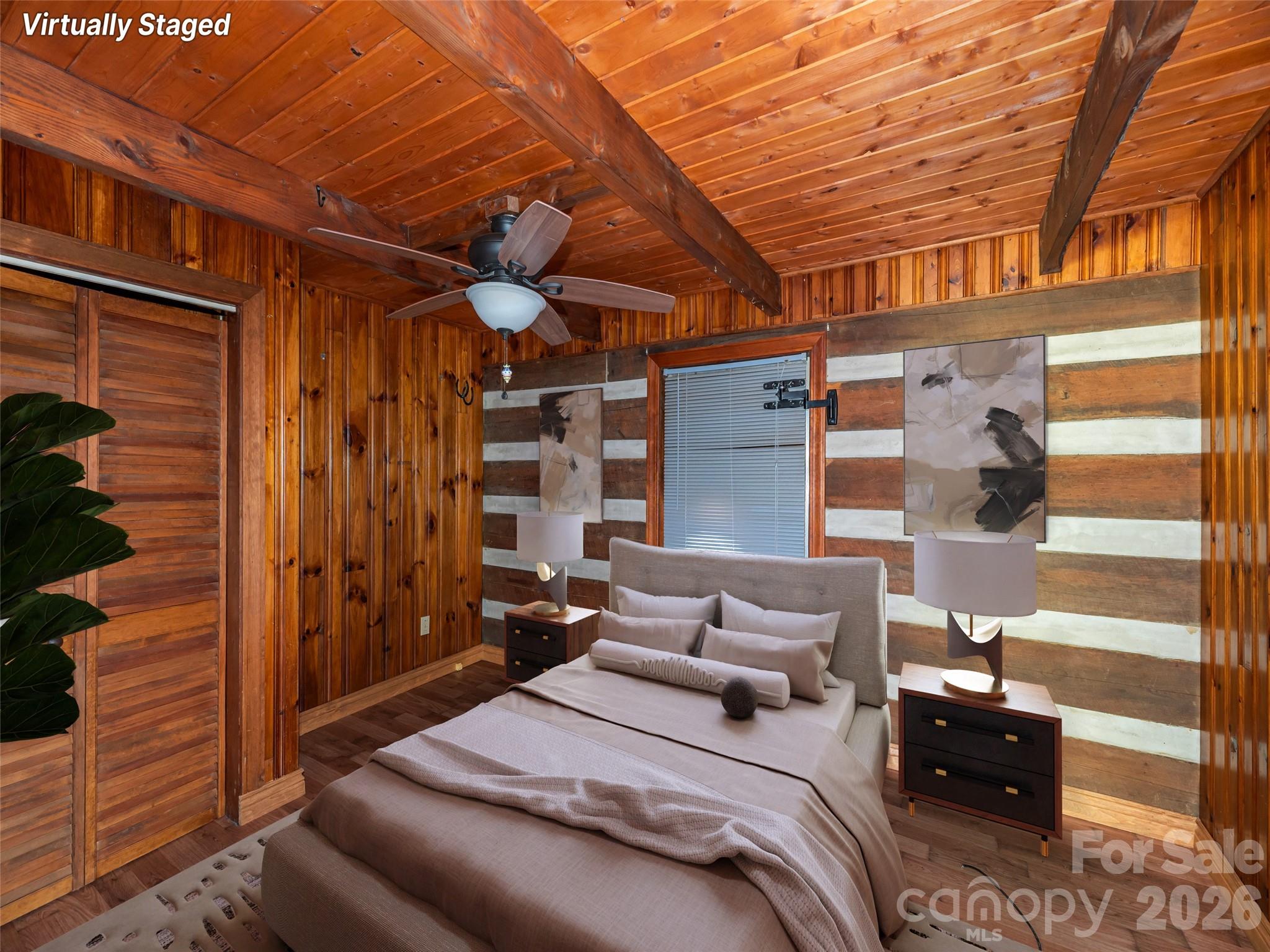 775 Chambers Cove Road Canton, NC 28716 - Photo 13 of 28 a bedroom with a bed and a walk in closet