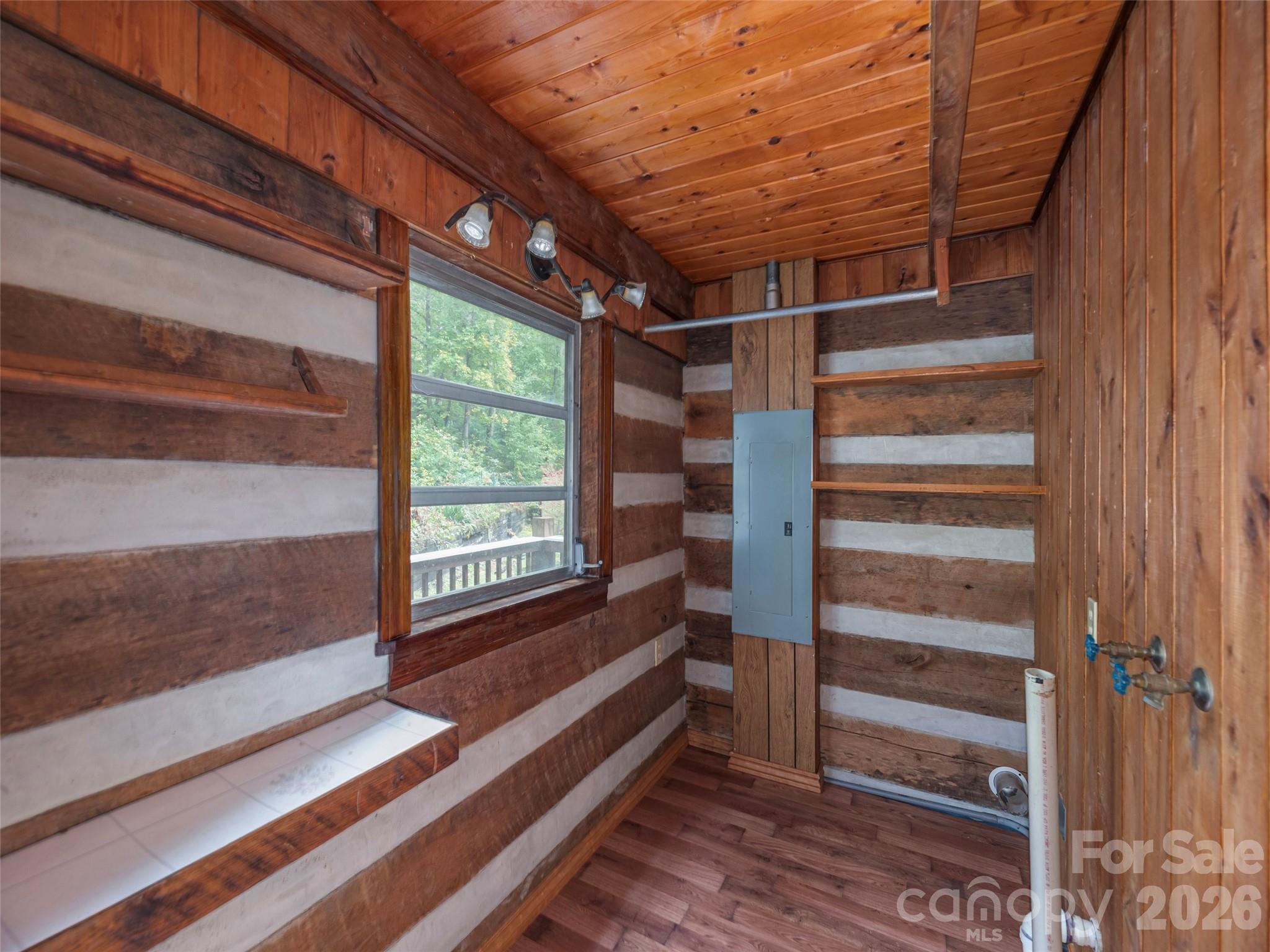 775 Chambers Cove Road Canton, NC 28716 - Photo 14 of 28 a view of walk in closet with empty racks