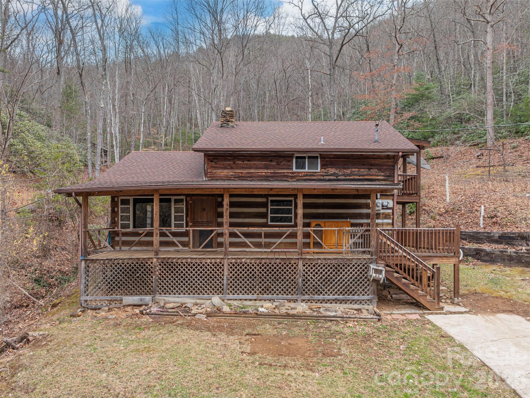 775 Chambers Cove Road Canton, NC 28716 - Photo 2 of 28 a view of a house with a roof deck