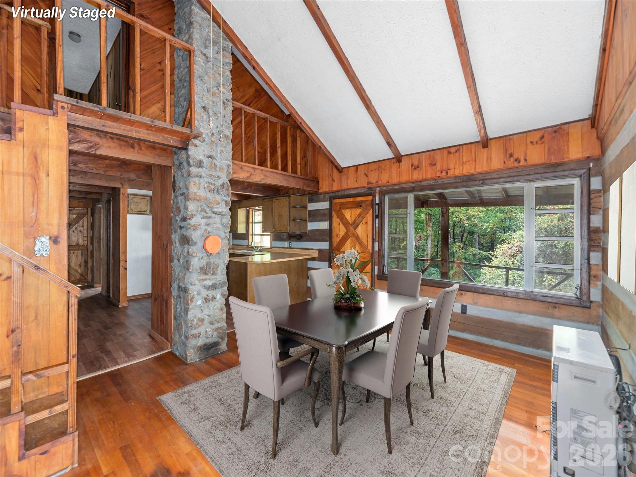 775 Chambers Cove Road Canton, NC 28716 - Photo 9 of 28 a dining room with furniture a rug wooden floor and a rug