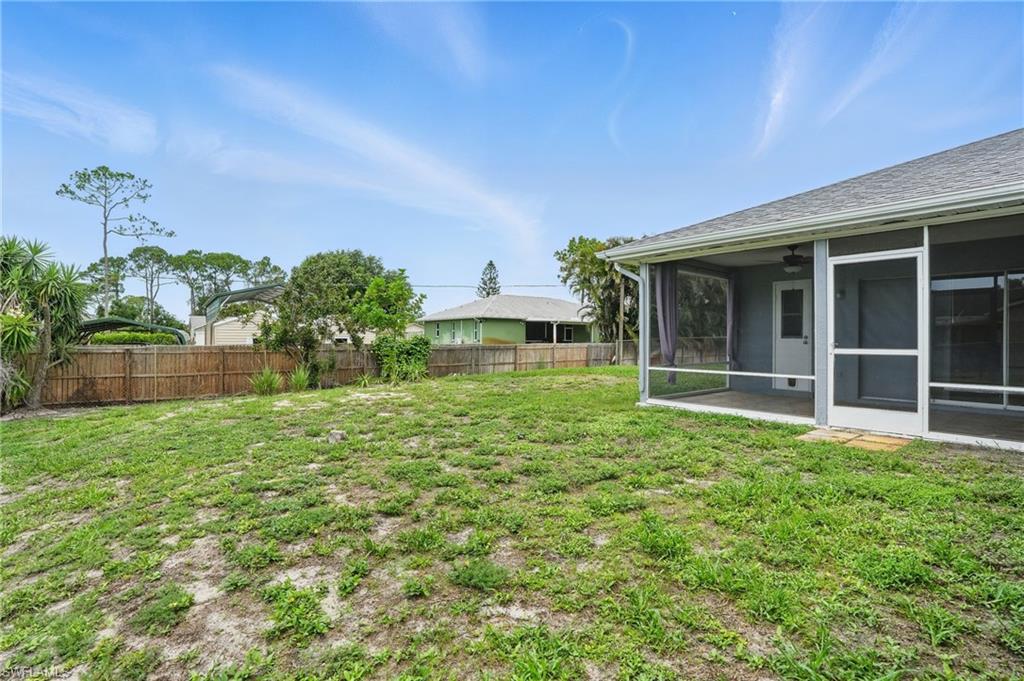 18210 Apple Road Fort Myers, FL 33967 - Photo 26 of 29 a front view of a house with a garden