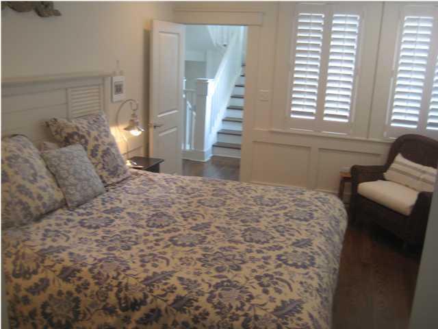 13 Chelsea Loop Road Santa Rosa Beach, FL 32459 - Photo 3 of 19 a large bed sitting in a bedroom next to a window