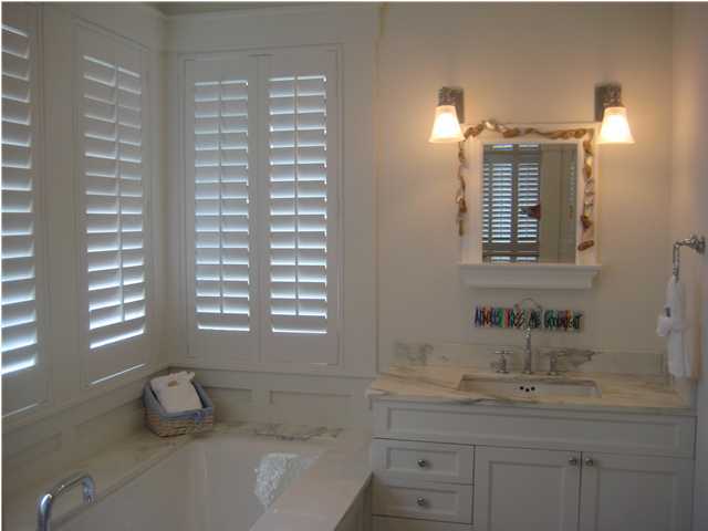 13 Chelsea Loop Road Santa Rosa Beach, FL 32459 - Photo 4 of 19 a bathroom with a granite countertop sink and a mirror