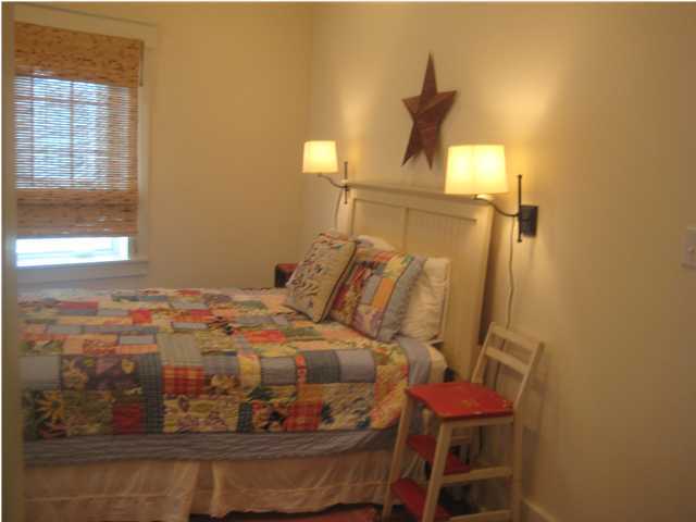 13 Chelsea Loop Road Santa Rosa Beach, FL 32459 - Photo 5 of 19 a bedroom with a bed and wooden floor