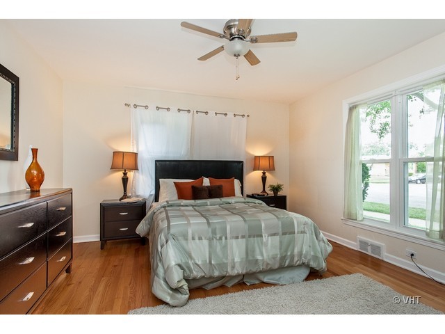 8500 Springfield Avenue Skokie, IL 60076 - Photo 11 of 15 a bedroom with a bed and window