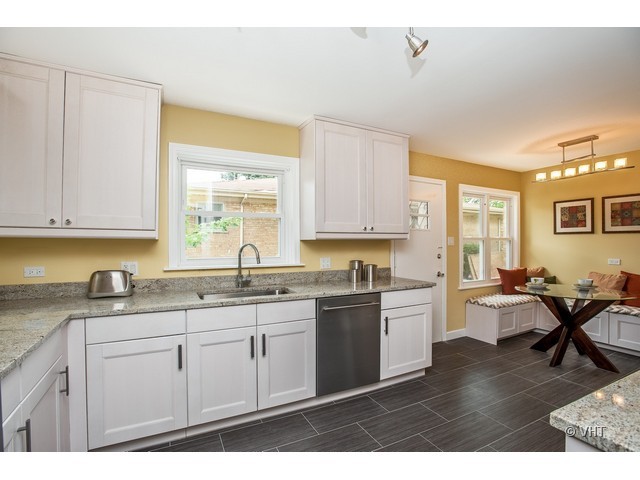 8500 Springfield Avenue Skokie, IL 60076 - Photo 5 of 15 a kitchen with a sink and cabinets