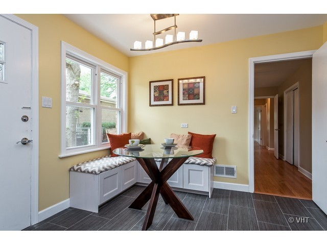 8500 Springfield Avenue Skokie, IL 60076 - Photo 6 of 15 a living room with a table and a window