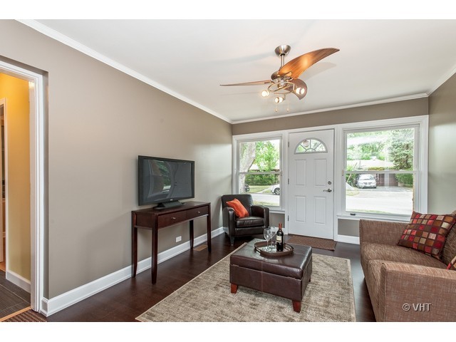 8500 Springfield Avenue Skokie, IL 60076 - Photo 8 of 15 a living room with furniture and a flat screen tv