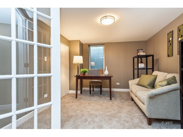 8500 Springfield Avenue Skokie, IL 60076 - Photo 9 of 15 a living room with furniture and a table