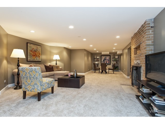 8500 Springfield Avenue Skokie, IL 60076 - Photo 10 of 15 a living room with furniture and a flat screen tv