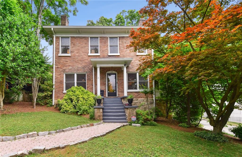 front view of a house with a yard