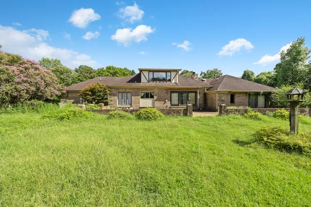 a view of a house with a big yard