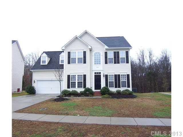289 Lorraine Road Fort Mill, SC 29708 - Photo 1 of 16 a front view of a house with a yard and garage