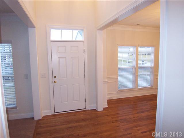289 Lorraine Road Fort Mill, SC 29708 - Photo 2 of 16 a view of an empty room with wooden floor and a window