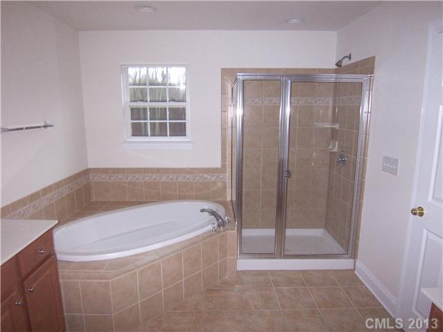289 Lorraine Road Fort Mill, SC 29708 - Photo 13 of 16 a bathroom with a bathtub and shower